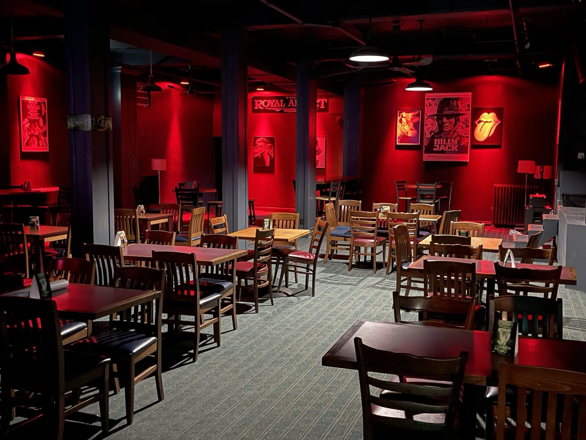 The main room set up with tables facing the stage